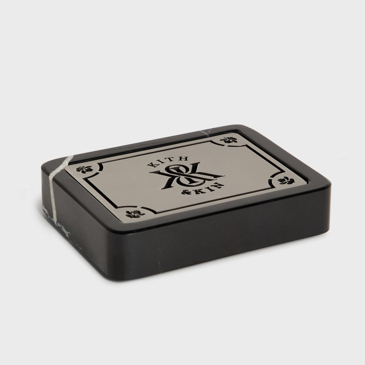 Black marble Kith & Kin soap dish, angled view, with the metal lid on