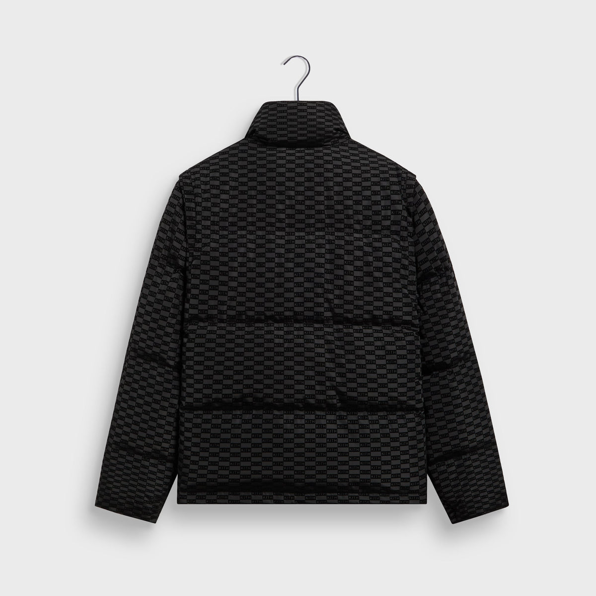 Kith Flocked Monogram Westley Convertible Puffer in black, back view, monogram-flocked puffer