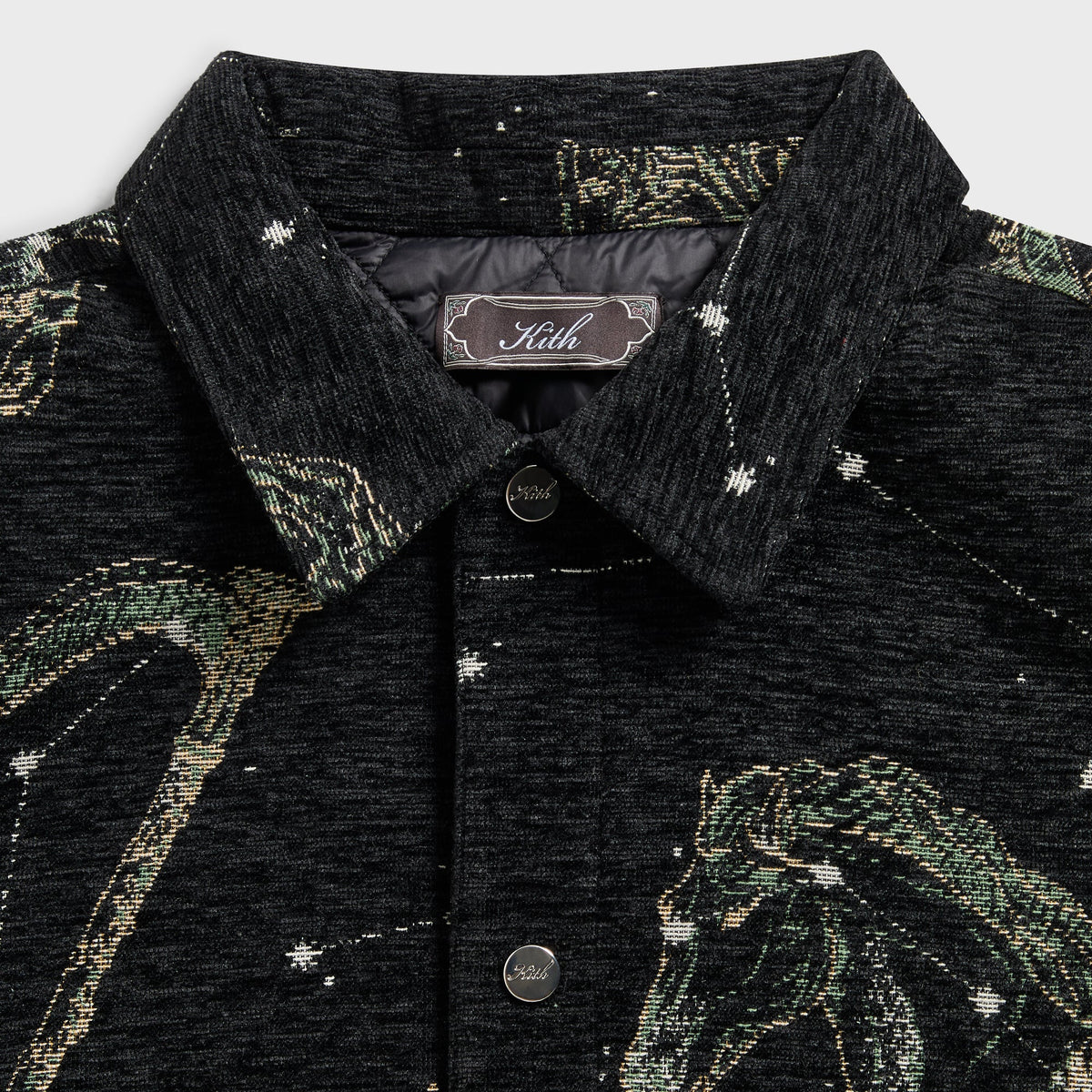 Close-up of the collar and Kith label on the black Chenille Tapestry Helios jacket