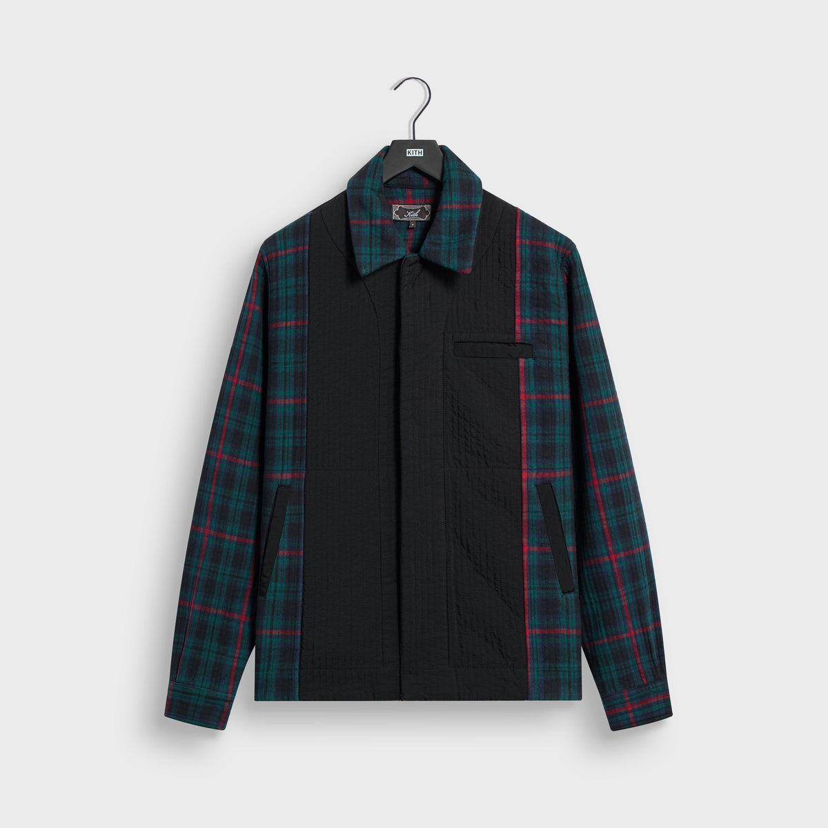 Kith Quilted Flannel Boxy Collared Overshirt in green and navy plaid with a black quilted front panel, front view