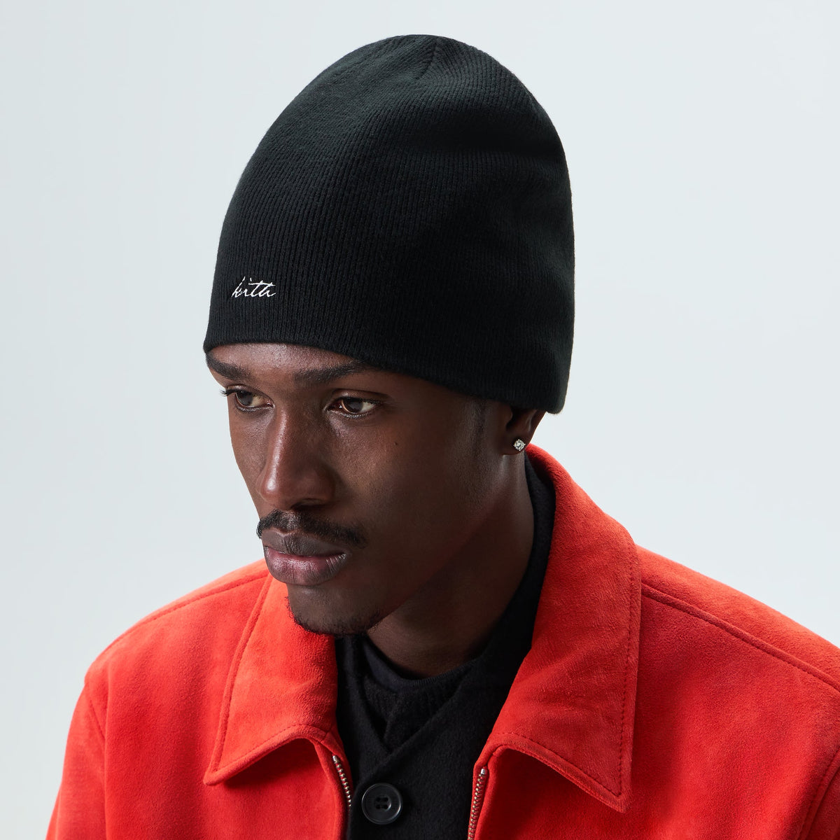 Man wearing black Kith Acrylic Cito beanie, front view